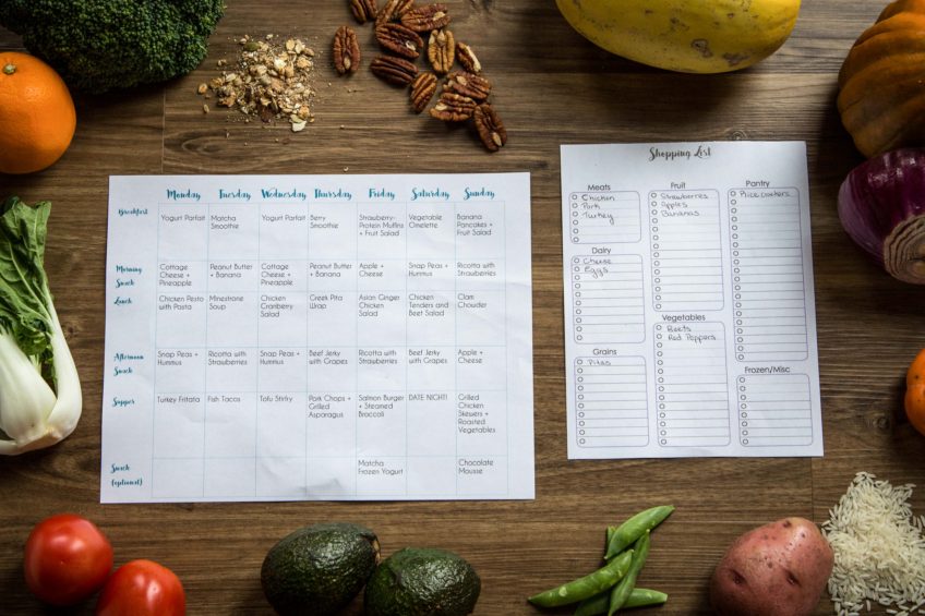 Healthy meal ingredients including fresh vegetables, grains, and spices displayed on a wooden table, representing an individualized meal plan.